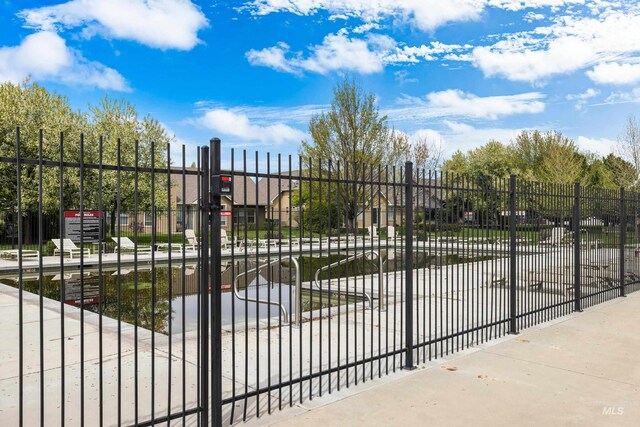 view of gate featuring fence