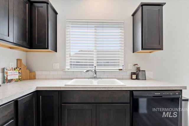 kitchen featuring light countertops, a sink, and dishwasher