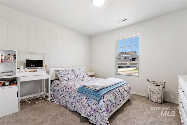 bedroom featuring carpet floors, baseboards, and visible vents