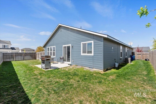back of house featuring a fenced backyard, a patio, a yard, and central air condition unit