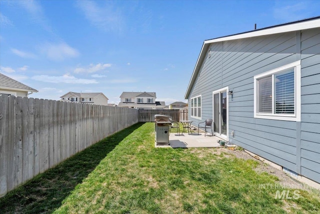 view of yard featuring a patio and a fenced backyard