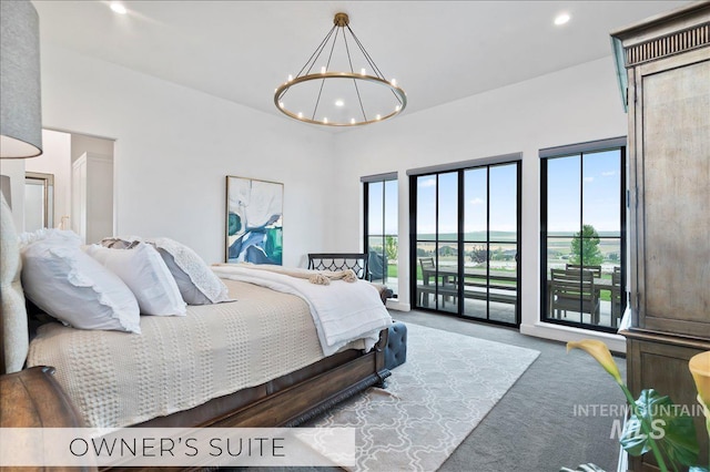 carpeted bedroom with recessed lighting, access to outside, and a notable chandelier