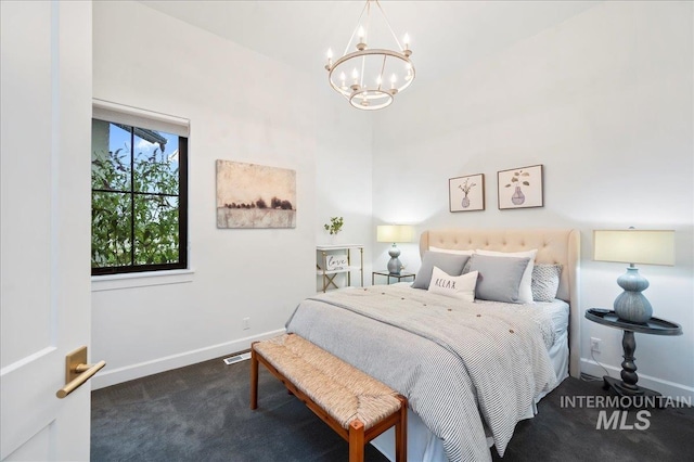 bedroom featuring carpet, an inviting chandelier, and baseboards