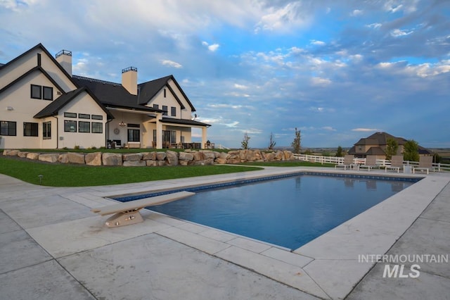 outdoor pool featuring a patio