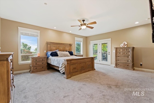 bedroom with access to exterior, light colored carpet, and ceiling fan