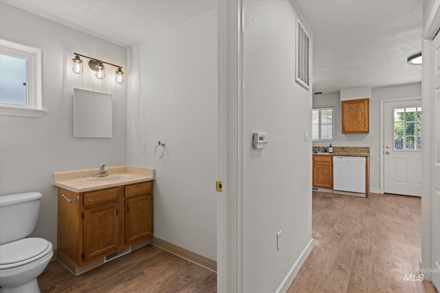 1420 S Denver, Boise, ID 83706 - bathroom with vanity, wood finished floors, toilet, and baseboards