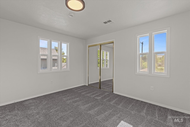 1420 S Denver, Boise, ID 83706 - unfurnished bedroom with dark carpet, baseboards, and a closet