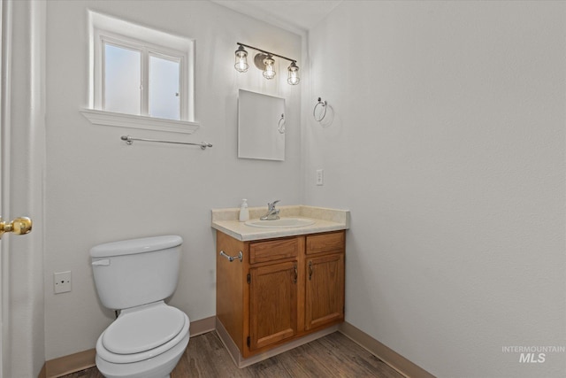1420 S Denver, Boise, ID 83706 - bathroom featuring vanity, toilet, wood finished floors, and baseboards