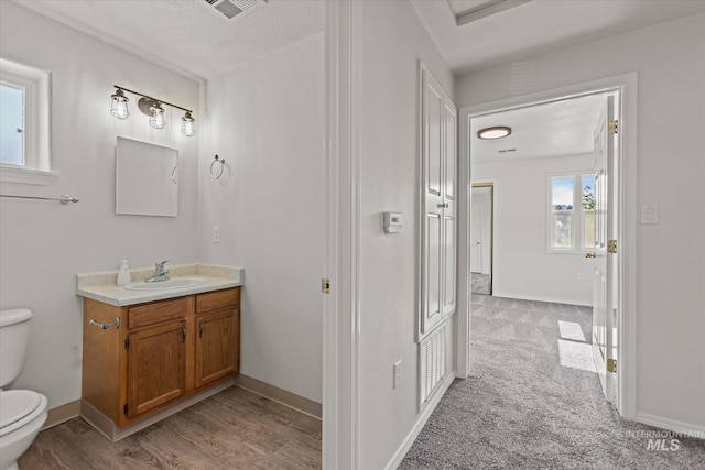 1420 S Denver, Boise, ID 83706 - bathroom with toilet, vanity, and baseboards