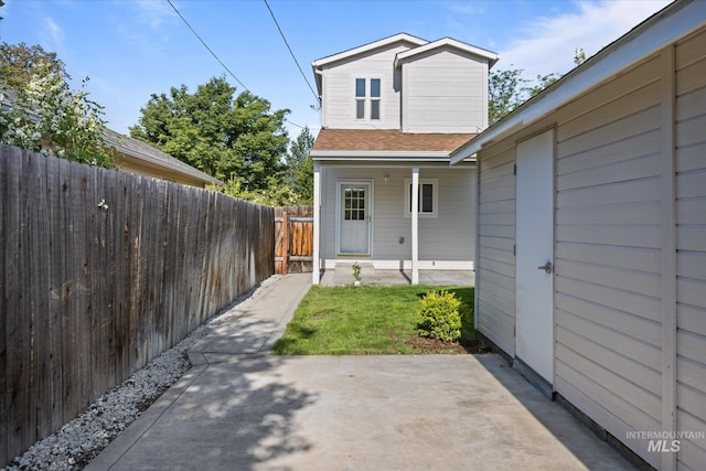 1420 S Denver, Boise, ID 83706 - back of house with a shingled roof, covered porch, and a patio area