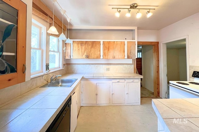 kitchen with tile countertops, range with electric stovetop, a sink, and dishwasher