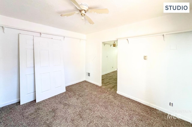 unfurnished bedroom with a closet, carpet flooring, visible vents, and baseboards