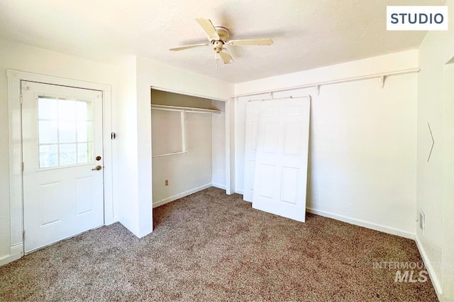 unfurnished bedroom featuring a closet, carpet flooring, ceiling fan, a textured ceiling, and baseboards