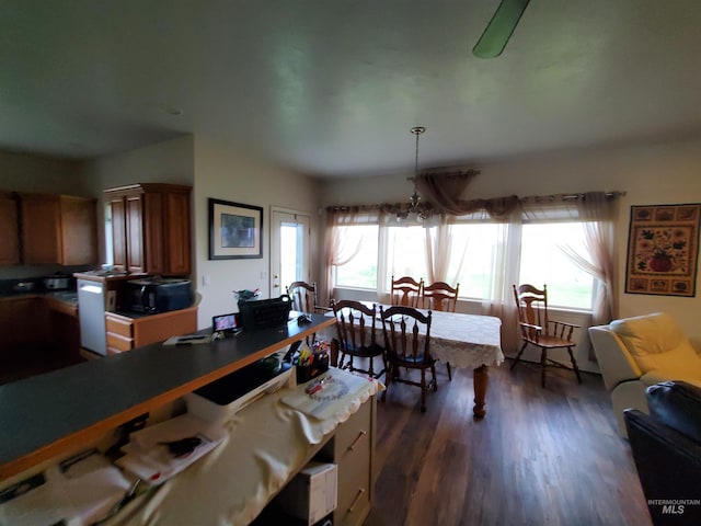 1441 Marie Dr, Gooding, ID 83330 - dining space with dark wood-type flooring and a chandelier