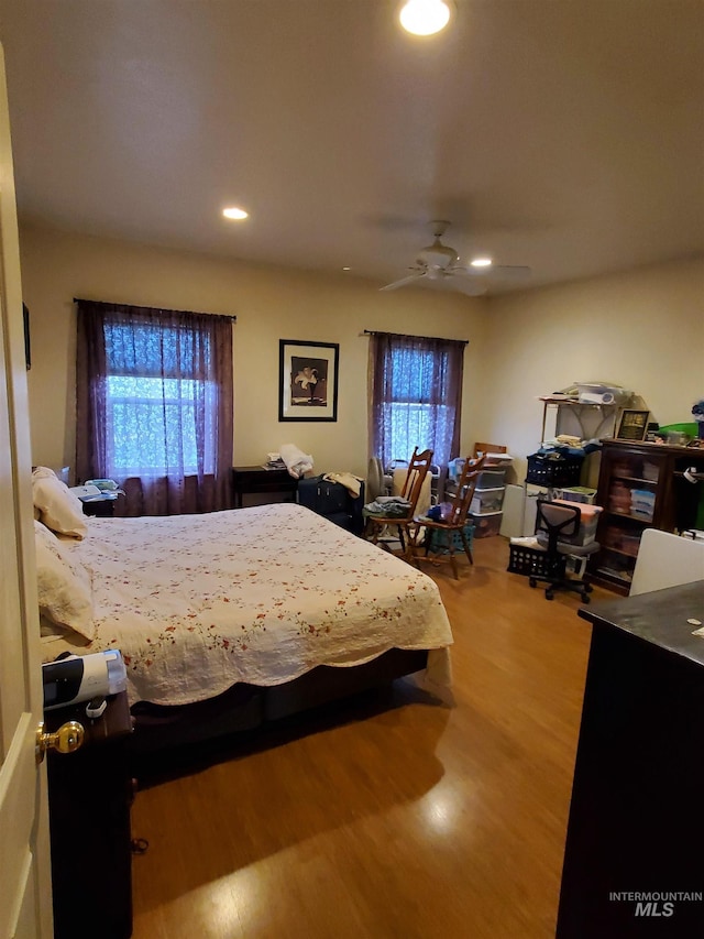 1441 Marie Dr, Gooding, ID 83330 - bedroom featuring wood finished floors, multiple windows, recessed lighting, and ceiling fan