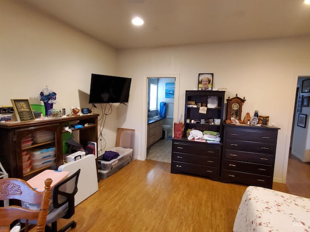 1441 Marie Dr, Gooding, ID 83330 - bedroom with wood finished floors, recessed lighting, baseboards, and ensuite bath