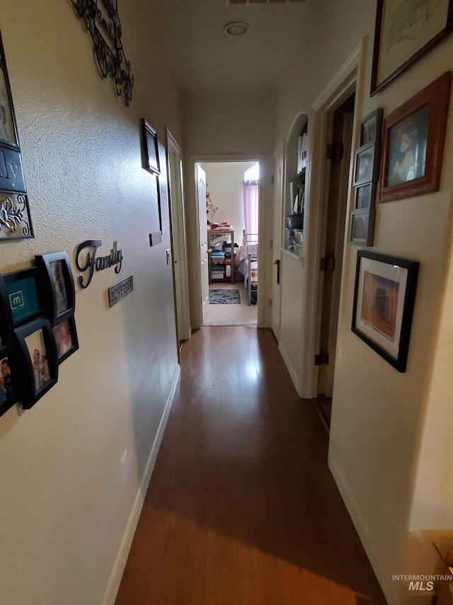 1441 Marie Dr, Gooding, ID 83330 - corridor featuring dark wood-style floors and baseboards