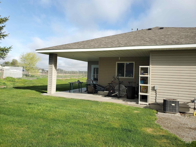 1441 Marie Dr, Gooding, ID 83330 - back of house featuring a shingled roof, a patio, and central air condition unit