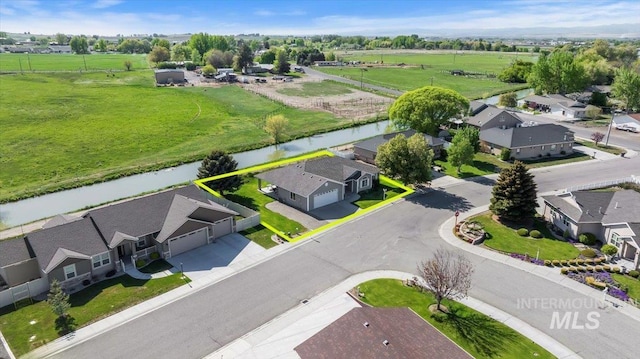 1441 Marie Dr, Gooding, ID 83330 - aerial view of residential area featuring a nearby body of water and property parcel outlined