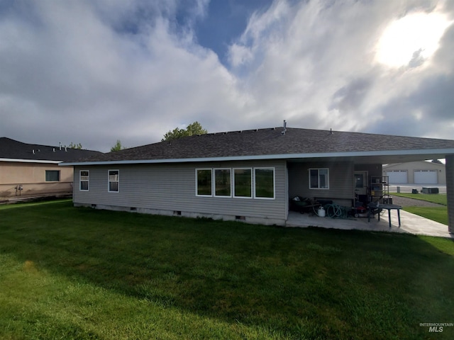 1441 Marie Dr, Gooding, ID 83330 - rear view of property with a patio area, a lawn, and crawl space