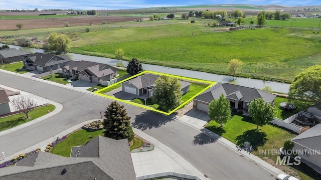 1441 Marie Dr, Gooding, ID 83330 - overview of rural landscape with property parcel outlined, a large body of water, and nearby suburban area