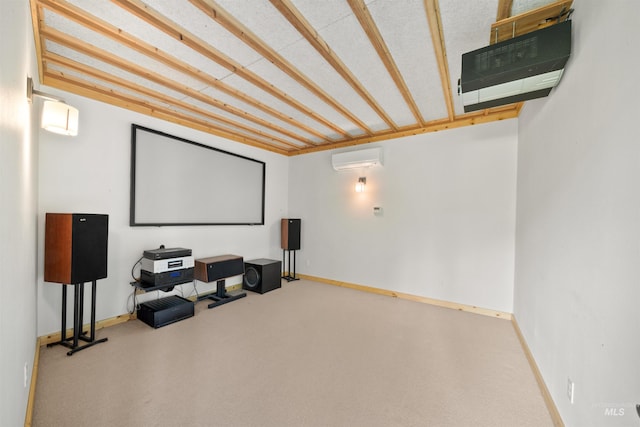 carpeted home theater room featuring a wall unit AC and baseboards