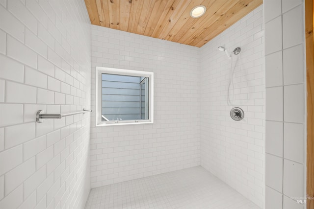 full bath featuring a tile shower, recessed lighting, and wooden ceiling