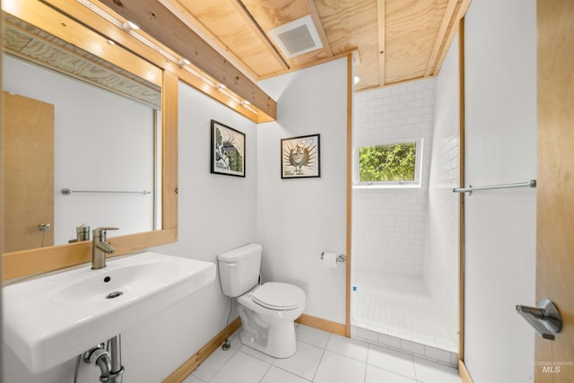 full bathroom featuring toilet, baseboards, tile patterned flooring, and a sink