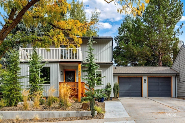 view of front of home featuring a balcony and a garage