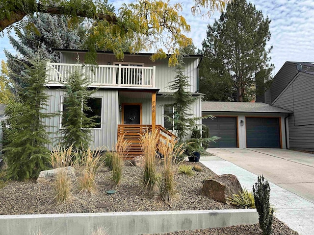 view of front facade featuring a garage and a balcony