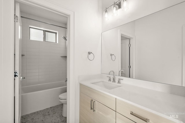 full bathroom featuring  shower combination, vanity, and toilet