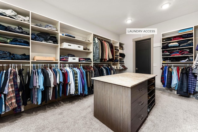 walk in closet featuring carpet