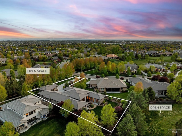 aerial view at dusk with a residential view