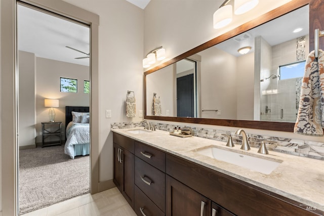 bathroom with plenty of natural light, a sink, and a shower with door