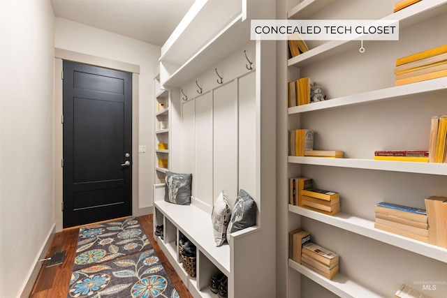 mudroom with baseboards, wood finished floors, and visible vents