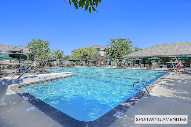 community pool with a patio area