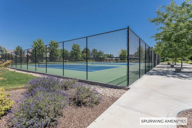 view of sport court with fence
