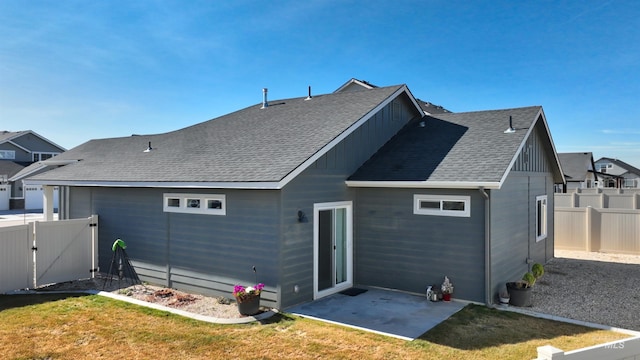 6240 W Black Butte St, Meridian, ID 83646 - rear view of house with a fenced backyard, a gate, a shingled roof, and a patio