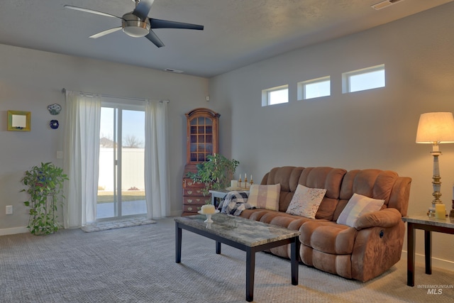 6240 W Black Butte St, Meridian, ID 83646 - living room with light colored carpet, visible vents, baseboards, and a ceiling fan