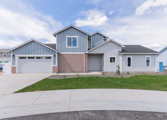 2117 Oxon St, Caldwell, ID 83605 - view of front facade with board and batten siding, an attached garage, concrete driveway, a front lawn, and brick siding