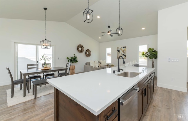 2117 Oxon St, Caldwell, ID 83605 - kitchen featuring dishwasher, a chandelier, lofted ceiling, a ceiling fan, and hanging light fixtures