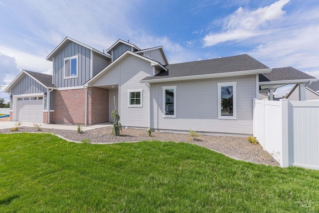 2117 Oxon St, Caldwell, ID 83605 - view of front facade featuring board and batten siding, a garage, and a shingled roof