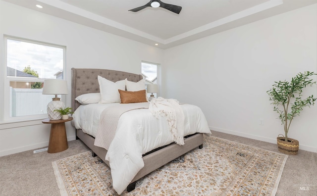 2117 Oxon St, Caldwell, ID 83605 - carpeted bedroom with a tray ceiling, ceiling fan, and recessed lighting