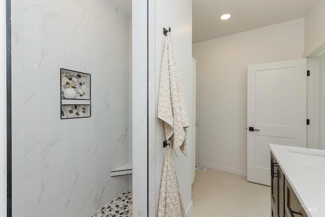 2117 Oxon St, Caldwell, ID 83605 - full bathroom featuring vanity, a tile shower, recessed lighting, and tile patterned floors