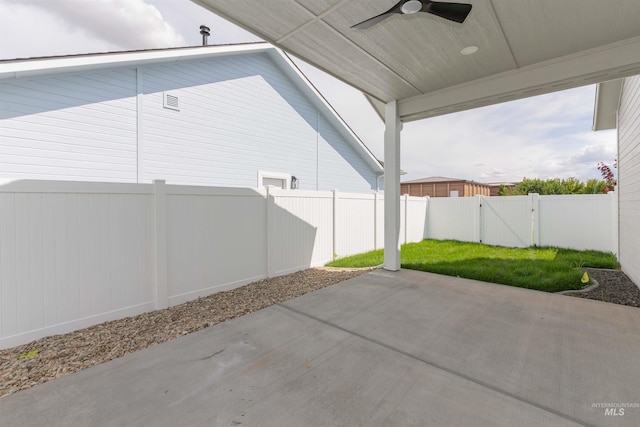 2117 Oxon St, Caldwell, ID 83605 - fenced backyard featuring a ceiling fan and a patio area