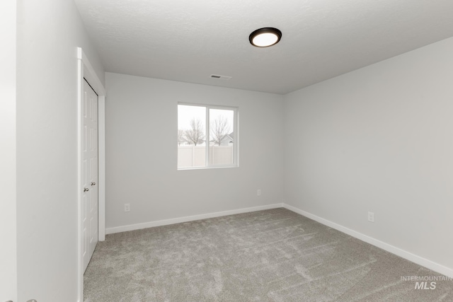 14761 N Ninja Way, Nampa, ID 83651 - unfurnished bedroom featuring carpet, visible vents, baseboards, a closet, and a textured ceiling