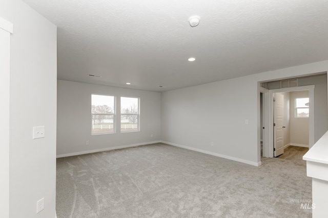 14761 N Ninja Way, Nampa, ID 83651 - empty room with a wealth of natural light, light colored carpet, and baseboards