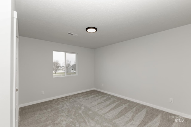 14761 N Ninja Way, Nampa, ID 83651 - carpeted spare room featuring visible vents, baseboards, and a textured ceiling