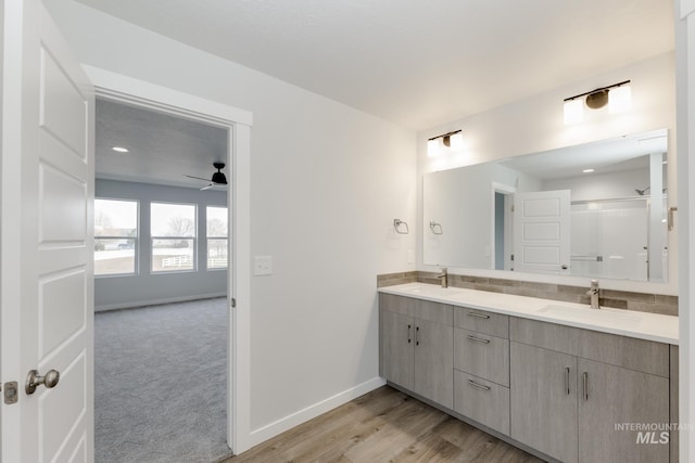 14761 N Ninja Way, Nampa, ID 83651 - full bathroom featuring double vanity, wood finished floors, baseboards, and a sink