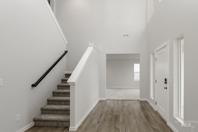 14761 N Ninja Way, Nampa, ID 83651 - foyer with visible vents, wood finished floors, baseboards, a towering ceiling, and stairs